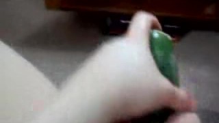 Slut takes huge cucumber in her pussy